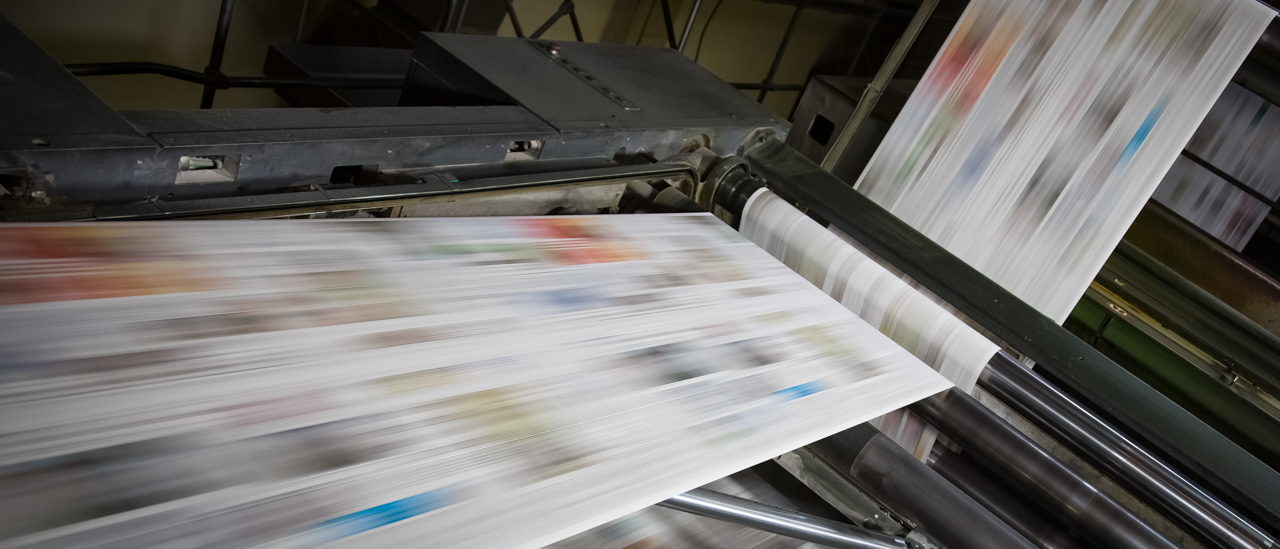 Newspapers printed on a large printing press