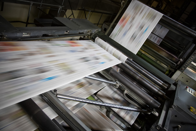 Newspapers printed on a large printing press