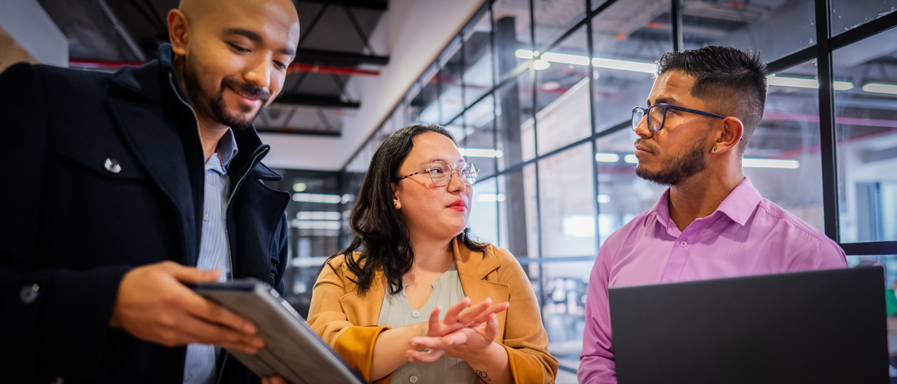 Businesswoman communicating in sign language with deaf coworker on the office.